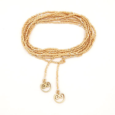 Collar enredable dorado detalles plata.
